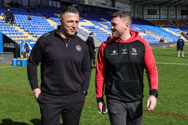 Sam Burgess head coach of Warrington Wolves and Scott Taylor head coach of Goole Vikings speak as the walk out on the pitch during the Betfred Challenge Cup round 4 match Goole Vikings vs Warrington Wolves at The Halliwell Jones Stadium, Warrington, United Kingdom on 14 March 2026

(Photo by Mark Cosgrove/News Images)