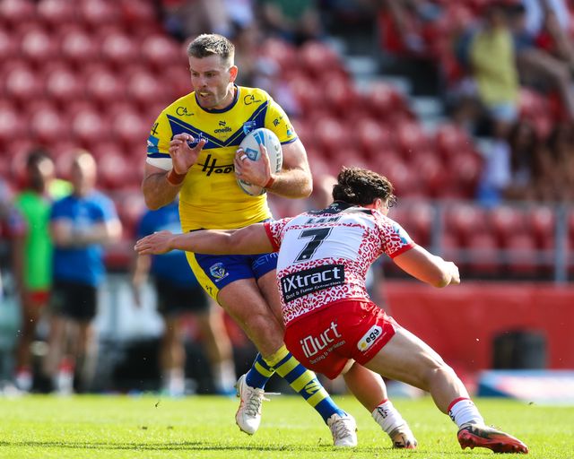 Lachlan Fitzgibbon of Warrington Wolves is tackled by Lachlan Lam of Leigh Leopards during the Betfred Challenge Cup Semi-final match Warrington Wolves vs Leigh Leopards at Totally Wicked Stadium, St Helens, United Kingdom, 11th May 2025

(Photo by Gareth Evans/News Images)
