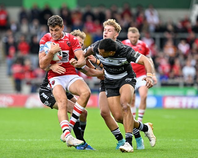 Sam Stone of Salford Red Devils gets tackled during the Betfred Super League Round 16 match Salford Red Devils vs Hull FC at Salford Community Stadium, Eccles, United Kingdom, 7th July 2024

(Photo by Cody Froggatt/News Images)
