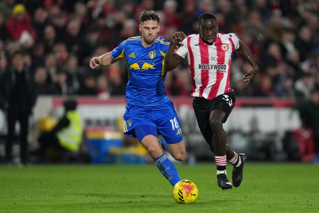 Michael Kayode of Brentford and Anton Stach of Leeds United during the Premier League match Brentford vs Leeds United at The Gtech Community Stadium, London, United Kingdom, 14th December 2025

(Photo by Harvey Murphy/News Images)

*** GER AUT SUI OUT ***