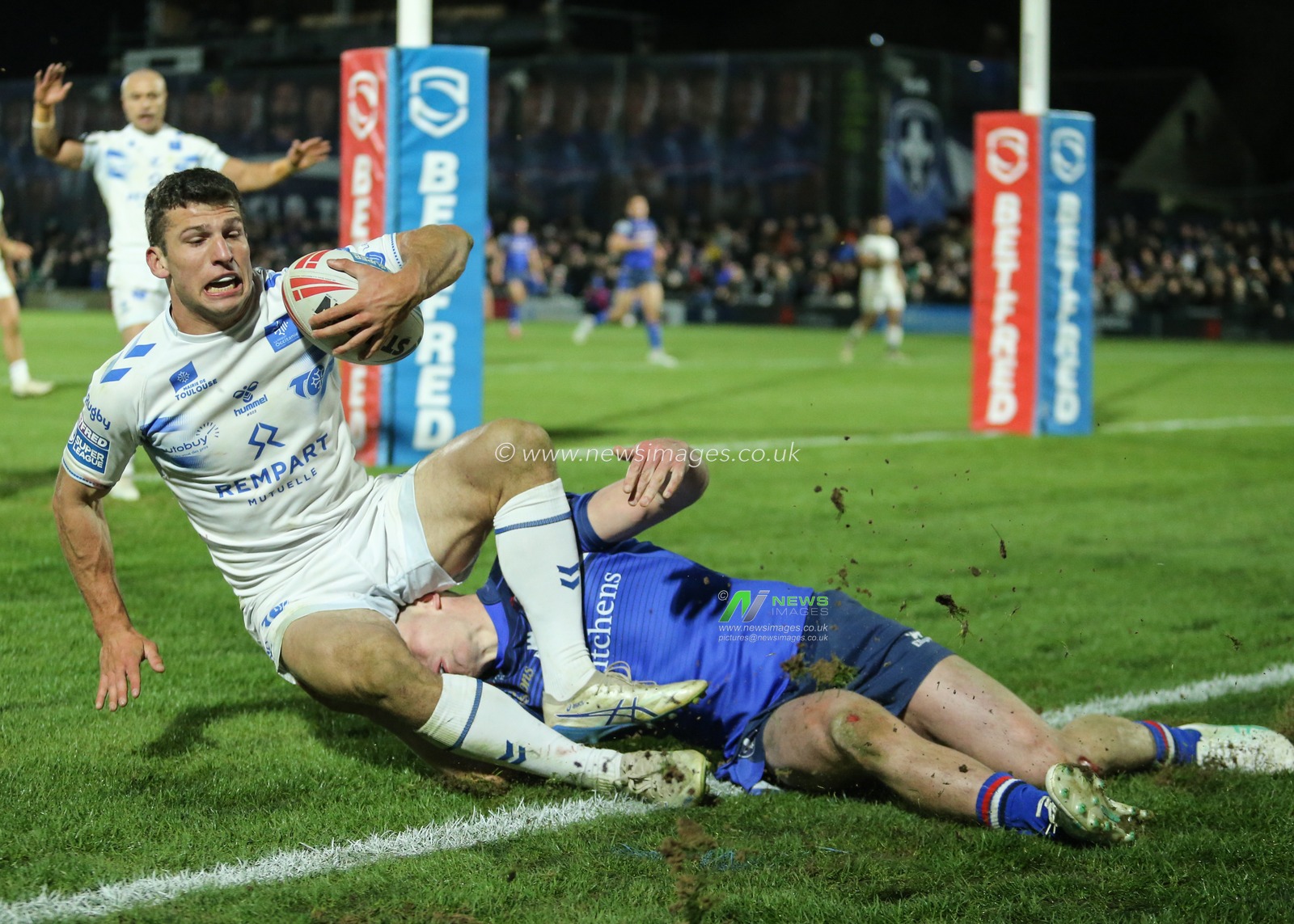 Romeo Tropis of Toulouse Olympique is tackled by Jake Trueman of Wakefield Trinity during the Betfred Super League Round 1 match Wakefield Trinity vs Toulouse Olympique at DIY Kitchens Stadium, Wakefield, United Kingdom on 14 February 2026

(Photo by Richard Bierton/News Images)