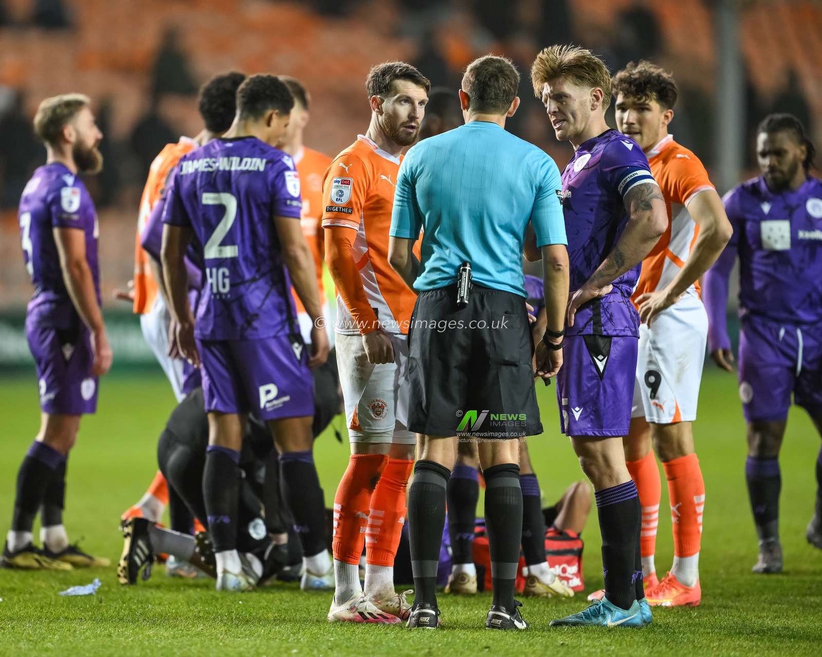 James Husband of Blackpool and Carl Piergianni of Stevenage speak to Referee Martin Woods during the Sky Bet League 1 match Blackpool vs Stevenage at Bloomfield Road, Blackpool, United Kingdom, 21st December 2024

(Photo by Craig Thomas/News Images)
