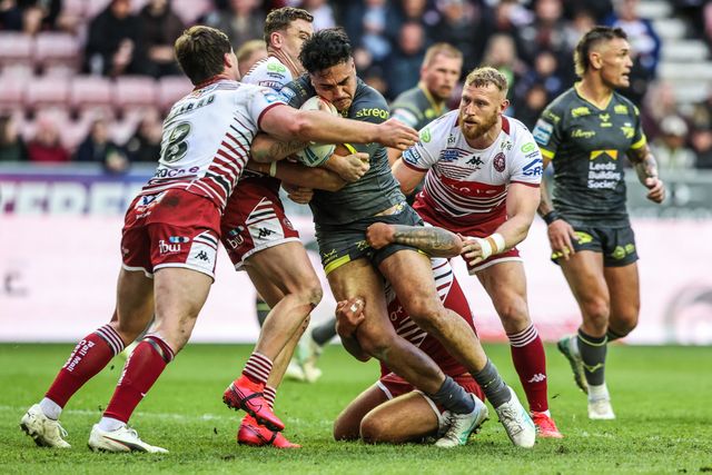 Keenan Palasia of Leeds Rhinos is tackled by Oliver Partington of Wigan Warriors during the Betfred Super League round 11 match Wigan Warriors vs Leeds Rhinos at The Brick Community Stadium, Wigan, United Kingdom on 15 May 2026

(Photo by Alfie Cosgrove/News Images)