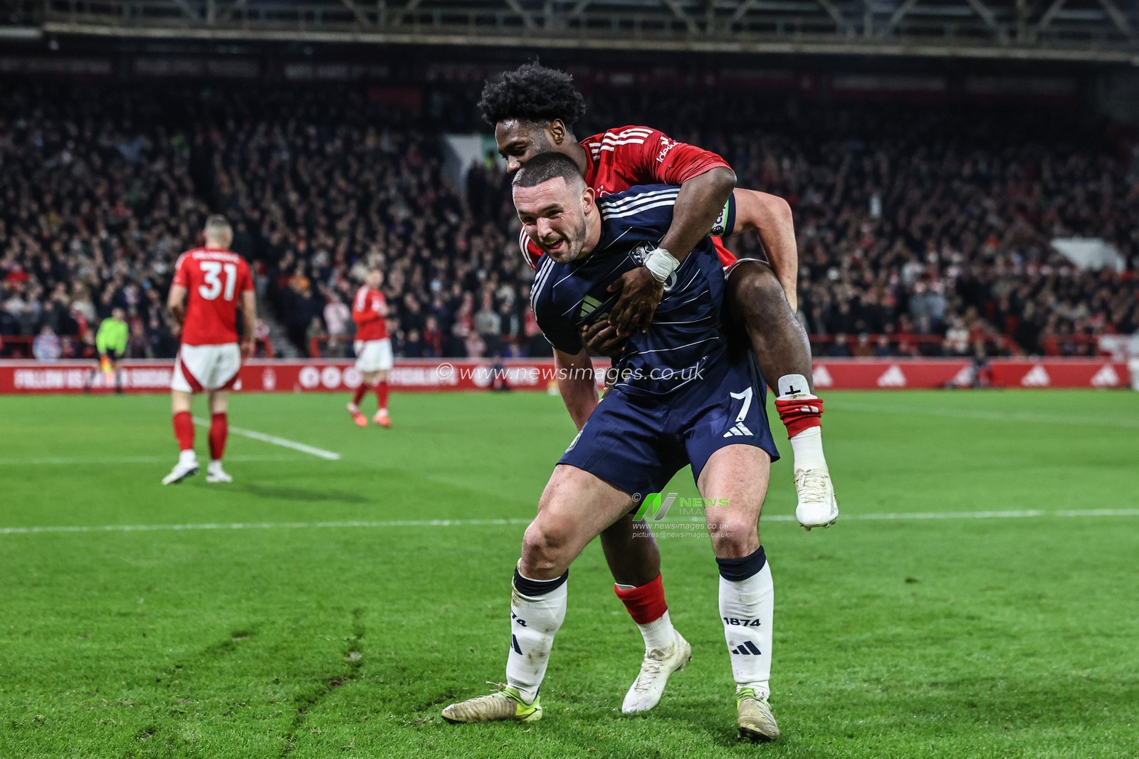 John McGinn of Aston Villa and Ola Aina of Nottingham Forest messing with each other after the ball goes out for a corner during the Premier League match Nottingham Forest vs Aston Villa at City Ground, Nottingham, United Kingdom, 14th December 2024

(Photo by Alfie Cosgrove/News Images)
