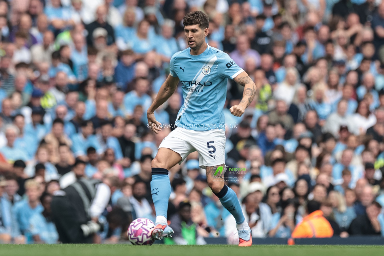 John Stones of Manchester City with the ball during the Premier League match Manchester City vs Tottenham Hotspur at Etihad Stadium, Manchester, United Kingdom, 23rd August 2025

(Photo by Mark Cosgrove/News Images)