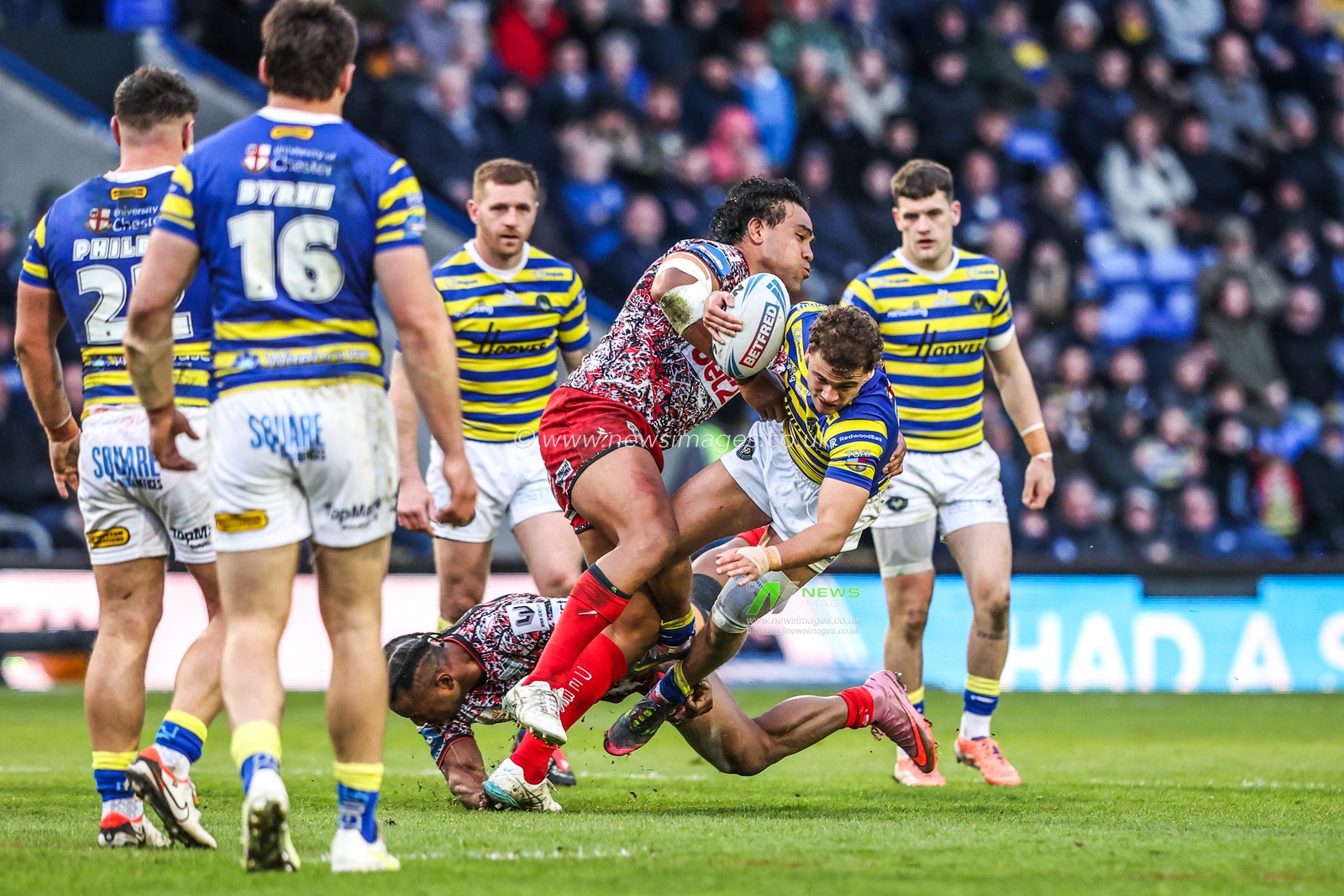 Cai Taylor-Wray of Warrington Wolves is tackled by Joe Ofahengaue of Leigh Leopards during the Betfred Challenge Cup Quarter Final match Warrington Wolves vs Leigh Leopards at The Halliwell Jones Stadium, Warrington, United Kingdom on 11 April 2026

(Photo by Alfie Cosgrove/News Images)