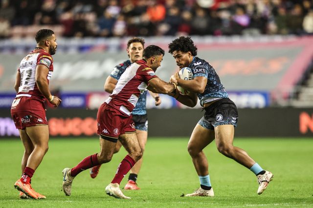 Alec Tuitavake of Leigh Leopards is tackled by Bevan French of Wigan Warriors during the Betfred Super League Semi Final 1 match Wigan Warriors vs Leigh Leopards at The Brick Community Stadium, Wigan, United Kingdom, 3rd October 2025

(Photo by Alfie Cosgrove/News Images)