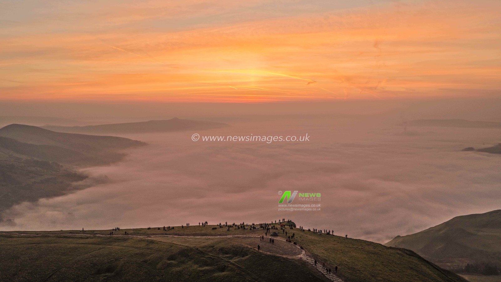 Sunrise hikers walk to the summit of Mam Tor as they watch the sunrise and admire the cloud inversion in the Hope Valley at Mam Tor in the Peak District at Mam Tor, Castleton, United Kingdom on 21 March 2026

(Photo by Mark Cosgrove/News Images)