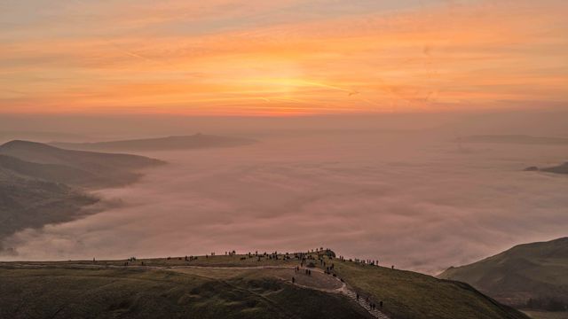 Sunrise hikers walk to the summit of Mam Tor as they watch the sunrise and admire the cloud inversion in the Hope Valley at Mam Tor in the Peak District at Mam Tor, Castleton, United Kingdom on 21 March 2026

(Photo by Mark Cosgrove/News Images)