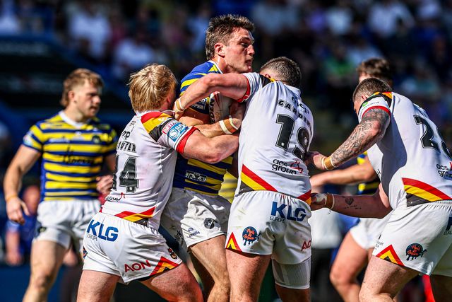 Liam Byrne of Warrington Wolves is tackled by Will Gardiner of Bradford Bulls and Mitch Souter of Bradford Bulls during the Betfred Super League round 12 match Warrington Wolves vs Bradford Bulls at The Halliwell Jones Stadium, Warrington, United Kingdom on 24 May 2026

(Photo by Alfie Cosgrove/News Images)