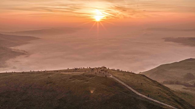 Sunrise hikers walk to the summit of Mam Tor as they watch the sunrise and admire the cloud inversion in the Hope Valley at Mam Tor in the Peak District at Mam Tor, Castleton, United Kingdom on 21 March 2026

(Photo by Mark Cosgrove/News Images)