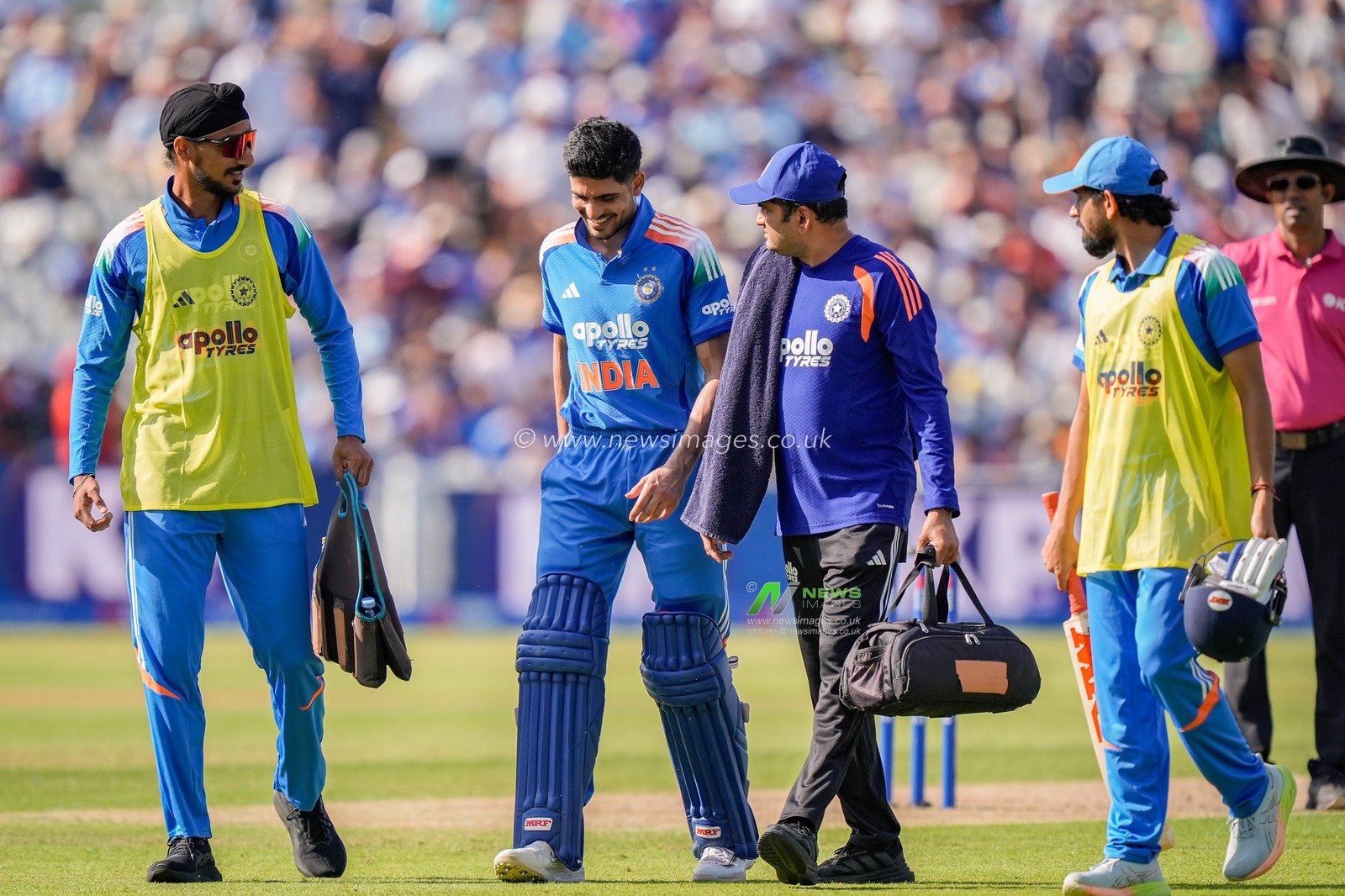 India captain Shubman Gill walks off the field escorted by team physio and teammates with a potential injury and retires hurt during the 1st Metro Bank ODI match England vs India at Edgbaston, Birmingham, United Kingdom on 14 July 2026

(Photo by Maynard Manyowa/News Images)
