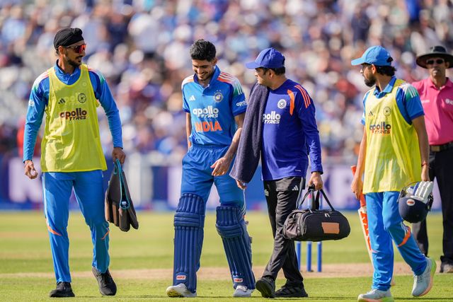 India captain Shubman Gill walks off the field escorted by team physio and teammates with a potential injury and retires hurt during the 1st Metro Bank ODI match England vs India at Edgbaston, Birmingham, United Kingdom on 14 July 2026

(Photo by Maynard Manyowa/News Images)