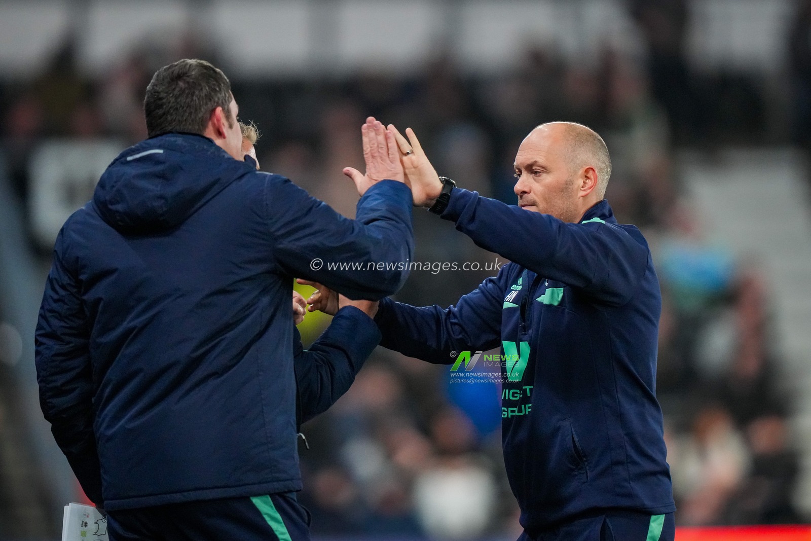 Alex Neil manager of Millwall celebrates with his technical team after his team scored to make it 0-1 during the Sky Bet Championship match Derby County vs Millwall at Pride Park Stadium, Derby, United Kingdom, 10th December 2025

(Photo by Maynard Manyowa/News Images)

*** GER AUT SUI OUT ***