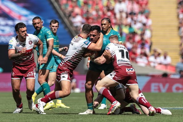 Sauaso Sue of Hull KR is tackled by Brad O'Neill of Wigan Warriors and Luke Thompson of Wigan Warriors during the Betfred Challenge Cup Final match Wigan Warriors vs Hull KR at Wembley Stadium, London, United Kingdom on 30 May 2026

(Photo by Mark Cosgrove/News Images)