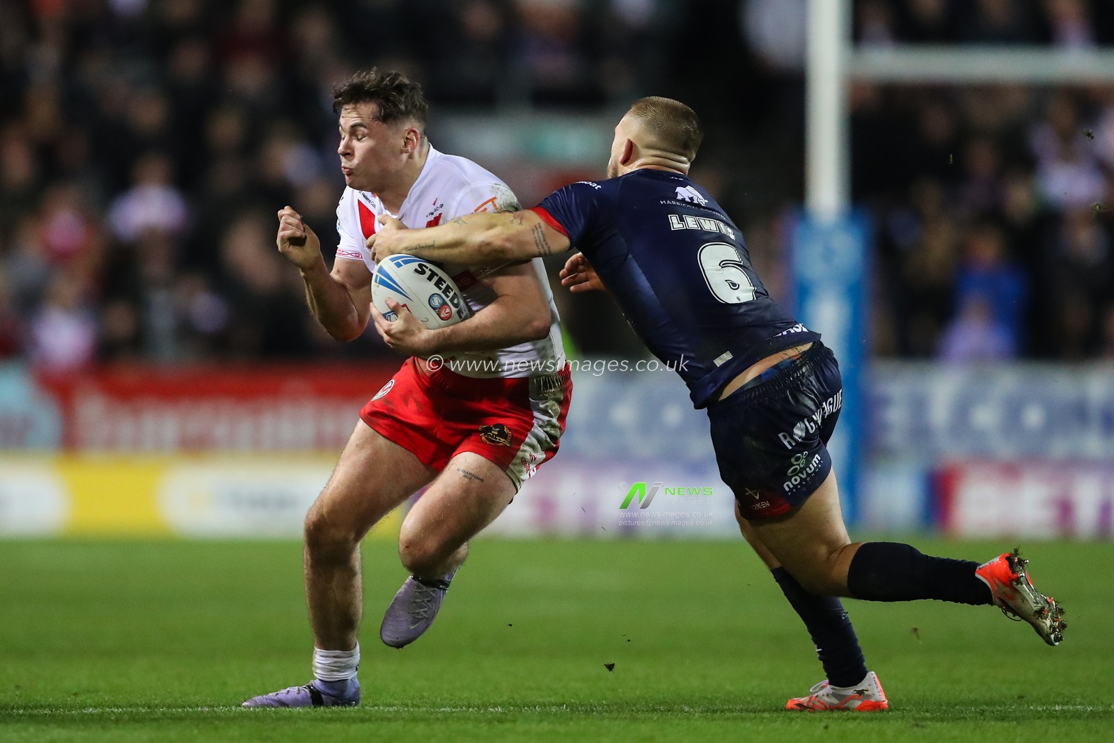 Jack Welsby of St. Helens is held onto by Mikey Lewis of Hull KR during the Betfred Super League Round 4 match St Helens vs Hull KR at Totally Wicked Stadium, St Helens, United Kingdom, 7th March 2025

(Photo by Gareth Evans/News Images)