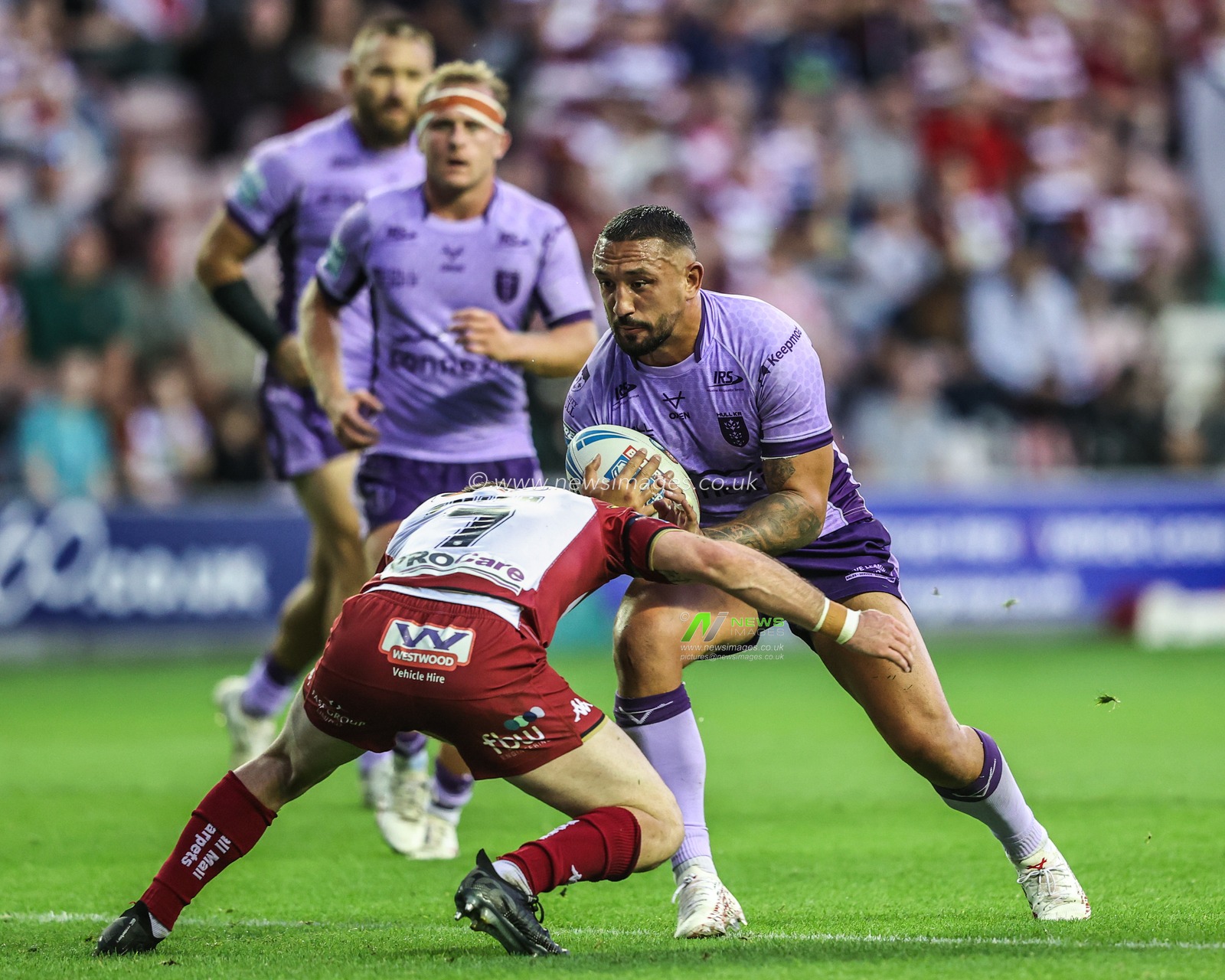 Elliot Minchella of Hull KR is tackled during the Betfred Super League round 22 match Wigan Warriors vs Hull KR at The Brick Community Stadium, Wigan, United Kingdom, 15th August 2025

(Photo by Alfie Cosgrove/News Images)
