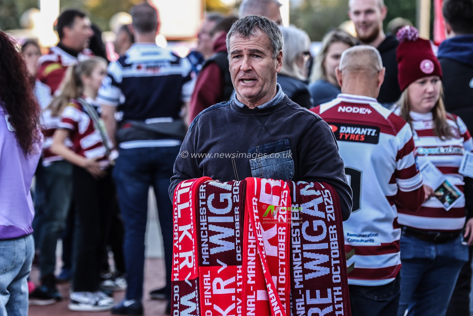A man selling 50/50 scarves outside of Old Trafford during the 2025 Betfred Super League Grand Final Hull KR v Wigan Warriors at Old Trafford, Manchester, United Kingdom, 11th October 2025

(Photo by Alfie Cosgrove/News Images)