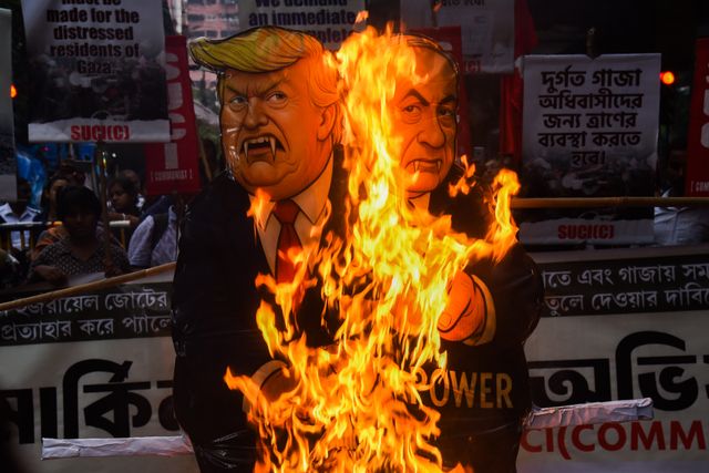 Activists from the Socialist Unity Centre of India (SUCI) burned an effigy of U.S. President Donald Trump and Israeli Prime Minister Benjamin Netanyahu during an anti-Israel protest to express solidarity with Palestinians, in Kolkata on October 7, 2025.Photo by Debajyoti Chakraborty.(Photo: Debajyoti Chakraborty/News Images)