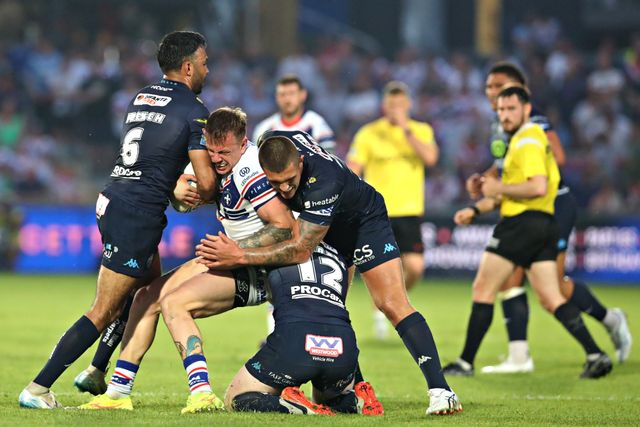 Bevan French of Wigan Warriors, Liam Farrell of Wigan Warriors and Brad O'Neill of Wigan Warriors tackle Tom Johnstone of Wakefield Trinity during the Betfred Super League round 15 match Wakefield Trinity vs Wigan Warriors at DIY Kitchens Stadium, Wakefield, United Kingdom, 20th June 2025

(Photo by Sam Eaden/News Images)