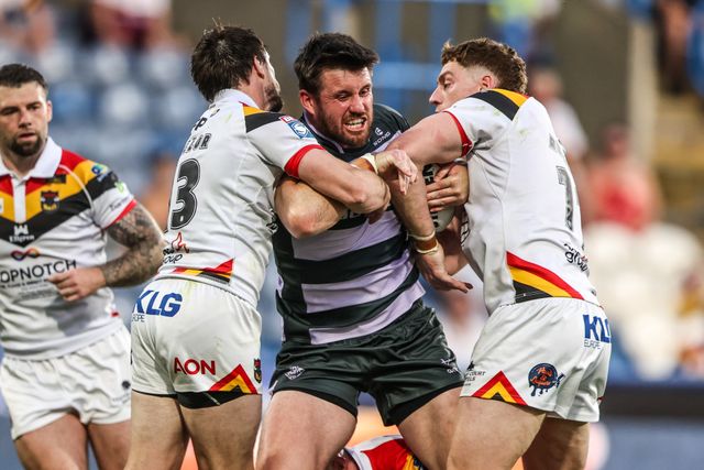 Joe Greenwood of Huddersfield Giants is tackled by Joe Mellor of Bradford Bulls and Dan Russell of Bradford Bulls during the Betfred Super League round 18 match Huddersfield Giants vs Bradford Bulls at Accu Stadium, Huddersfield, United Kingdom on 10 July 2026

(Photo by Alfie Cosgrove/News Images)