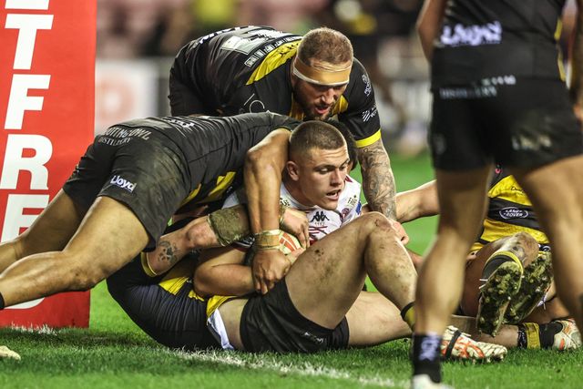 Brad O'Neill of Wigan Warriors is tackled on the try line during the Betfred Super League round 5 match Wigan Warriors vs York Knights at The Brick Community Stadium, Wigan, United Kingdom on 19 March 2026

(Photo by Alfie Cosgrove/News Images)