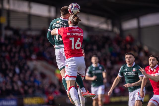 Will Forrester of Bolton Wanderers and Jay Rodriguez of Wrexham AFC battle for an aerial ball during the Sky Bet League 1 match Wrexham vs Bolton Wanderers at SToK Cae Ras, Wrexham, United Kingdom, 1st March 2025

(Photo by Nik Mesney/News Images)
