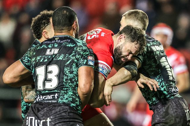 Alex Walmsley of St Helens is tackled by Isaac Liu of Leigh Leopards and Bailey Hodgson of Leigh Leopards during the Betfred Super League match St Helens vs Leigh Leopards at The BrewDog Stadium, St Helens, United Kingdom on 20 February 2026

(Photo by Alfie Cosgrove/News Images)