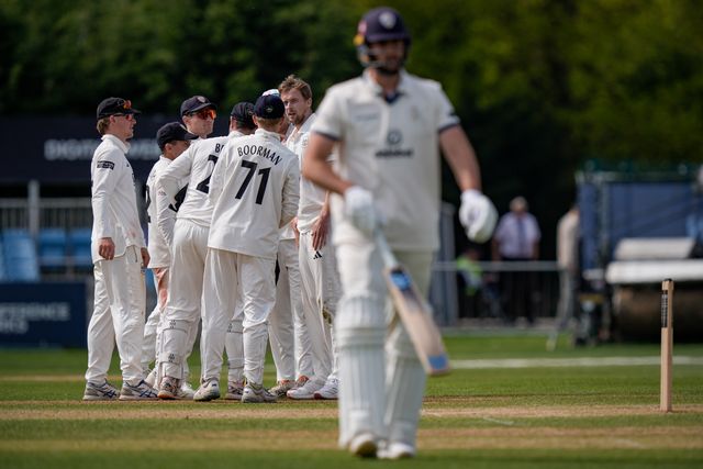 Ben Aitchison walks off after being caught by Cameron Bancroft off the bowling of Craig Miles as Gloucestershire players celebrate a wicket during the County Championship Division Two Derbyshire v Gloucestershire at The Central Co-Op County Ground, Derby, United Kingdom on 26 April 2026

(Photo by Maynard Manyowa/News Images)