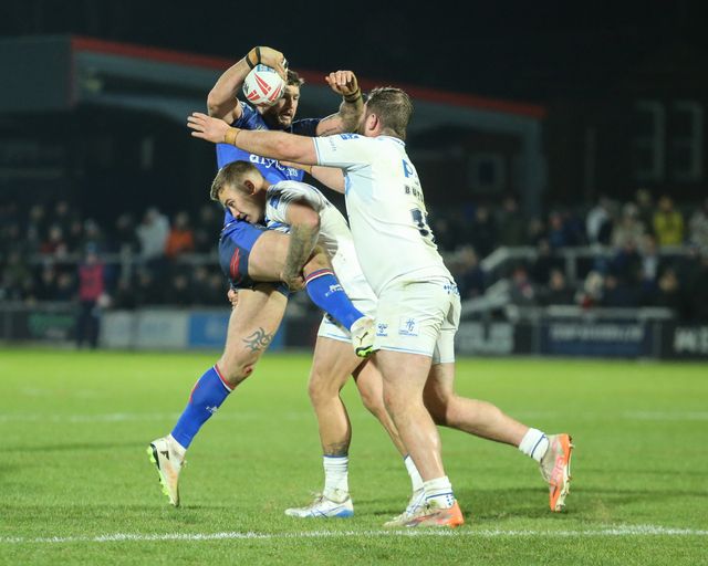 Jay Pitts of Wakefield Trinity is tackled by Brendan Hands of Toulouse Olympique during the Betfred Super League Round 1 match Wakefield Trinity vs Toulouse Olympique at DIY Kitchens Stadium, Wakefield, United Kingdom on 14 February 2026

(Photo by Richard Bierton/News Images)