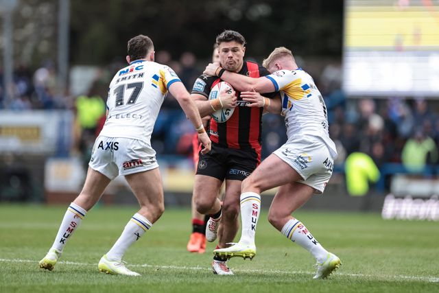 George Williams of Warrington Wolves is tackled by James McDonnell of Leeds Rhinos during the Betfred Super League round 6 match Leeds Rhinos vs Warrington Wolves at AMT Headingley Stadium, Leeds, United Kingdom on 29 March 2026

(Photo by Mark Cosgrove/News Images)