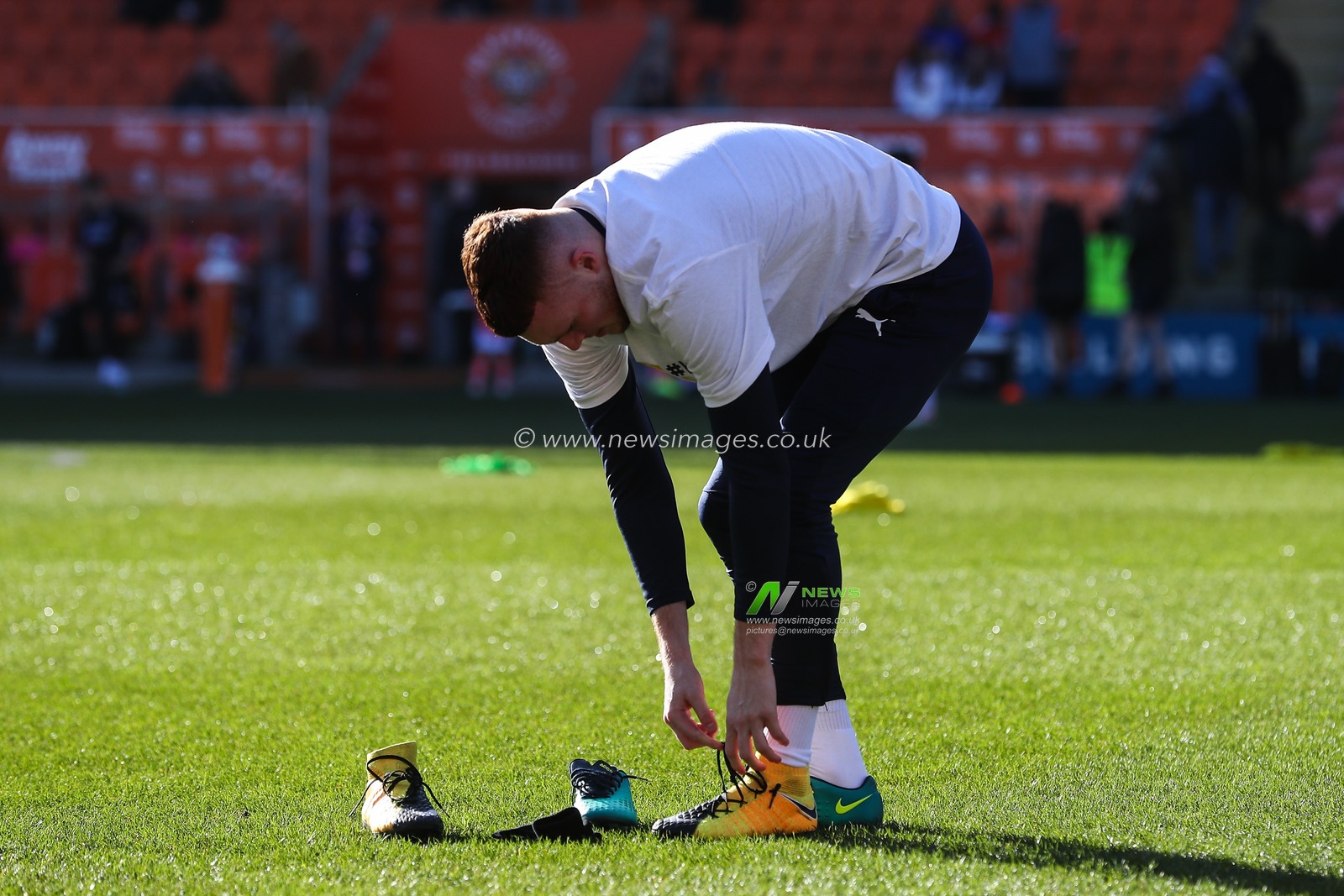 Sonny Carey of Blackpool changes his boots during the pre-game warm up ahead of the Sky Bet League 1 match Blackpool vs Crawley Town at Bloomfield Road, Blackpool, United Kingdom, 22nd February 2025

(Photo by Gareth Evans/News Images)