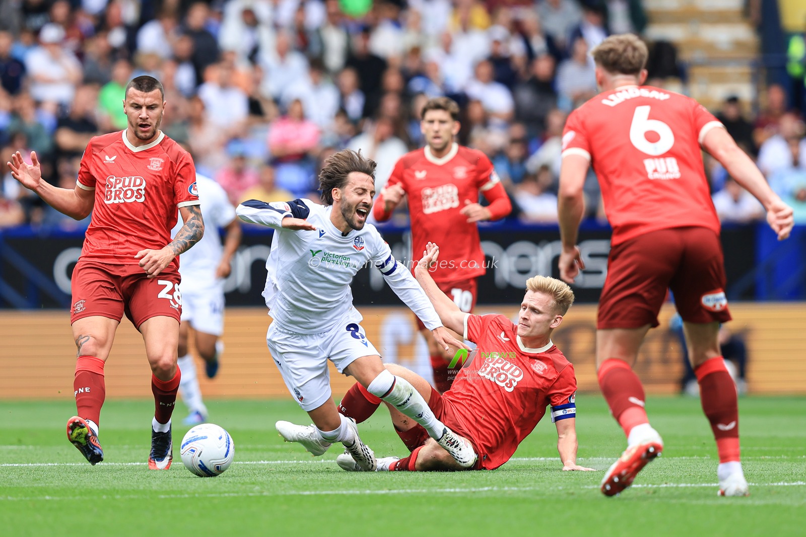 Josh Sheehan of Bolton Wanderers is tackles by Daniel Jebbison of Preston North End during the Sky Bet Championship match Bolton Wanderers vs Preston North End at Toughsheet Community Stadium, Bolton, United Kingdom on 15 August 2026

(Photo by Jorge Horsted/News Images)