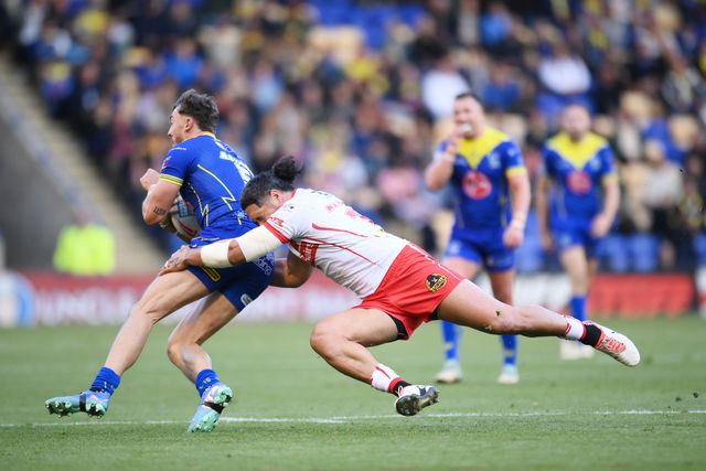 Matty Ashton of Warrington Wolves runs with the ball whilst under pressure from Sione Mata'utia of St. Helens during the Betfred Super League play-off Eliminator 2 Warrington Wolves v St Helens at Halliwell Jones Stadium, Warrington, United Kingdom, 28th September 2024

(Photo by Ben Roberts/News Images)