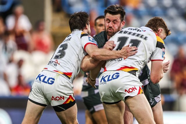 Joe Greenwood of Huddersfield Giants is tackled by Joe Mellor of Bradford Bulls and Dan Russell of Bradford Bulls during the Betfred Super League round 18 match Huddersfield Giants vs Bradford Bulls at Accu Stadium, Huddersfield, United Kingdom on 10 July 2026

(Photo by Alfie Cosgrove/News Images)