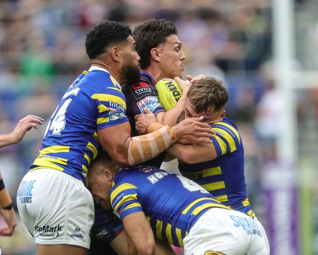 Owen Trout of Leigh Leopards is tackled by Leon Hayes of Warrington Wolves, Albert Hopoate of Warrington Wolves and Lachlan Webster of Warrington Wolves during the Betfred Super League Magic Weekend match Leigh Leopards vs Warrington Wolves at Hill Dickinson Stadium, Liverpool, United Kingdom on 04 July 2026

(Photo by Mark Cosgrove/News Images)