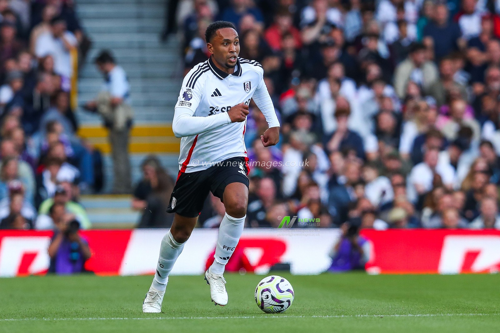 Kenny Tete of Fulham runs with the ball during the Premier League match Fulham vs West Ham United at Craven Cottage, London, United Kingdom, 14th September 2024

(Photo by Izzy Poles/News Images)
