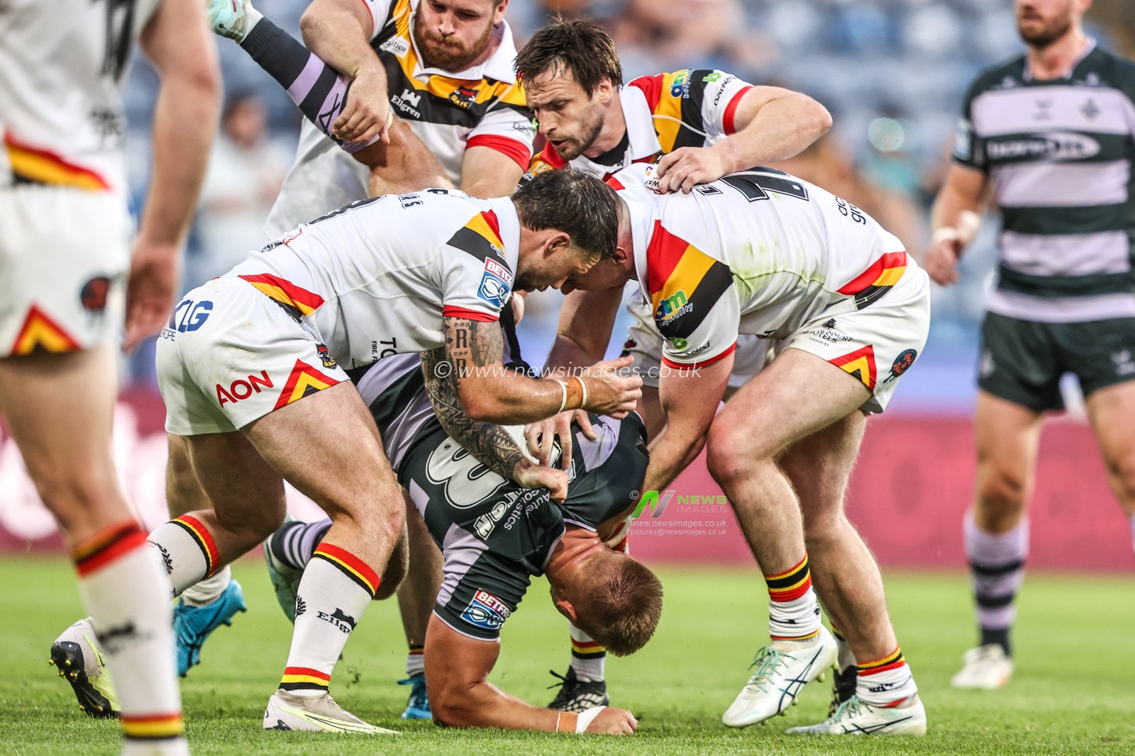 Harry Rushton of Huddersfield Giants is tackled by Andy Ackers of Bradford Bulls and Loghan Lewis of Bradford Bulls during the Betfred Super League round 18 match Huddersfield Giants vs Bradford Bulls at Accu Stadium, Huddersfield, United Kingdom on 10 July 2026

(Photo by Alfie Cosgrove/News Images)