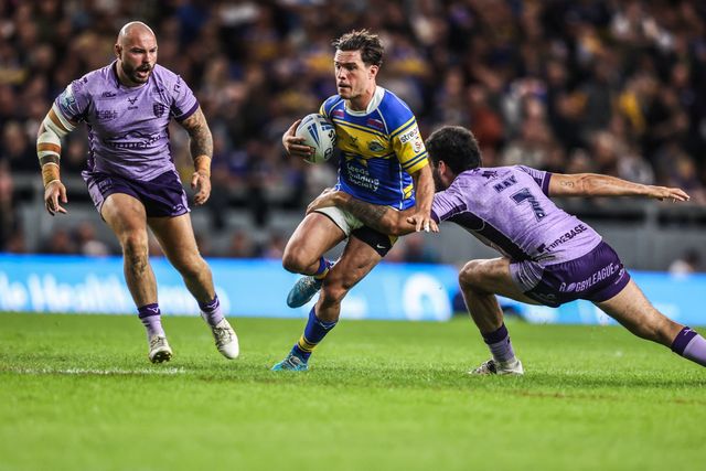 Brodie Croft of Leeds Rhinos is tackled by Tyrone May of Hull KR during the Betfred Super League round 23 match Leeds Rhinos vs Hull KR at Headingley Stadium, Leeds, United Kingdom, 21st August 2025

(Photo by Alfie Cosgrove/News Images)