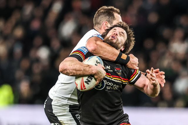 Joe Mellor of Bradford Bulls is tackled by the neck by Aidan Sezer of Hull FC during the Betfred Super League round 1 match Hull FC vs Bradford Bulls at MKM Stadium, Hull, United Kingdom on 14 February 2026

(Photo by Alfie Cosgrove/News Images)
