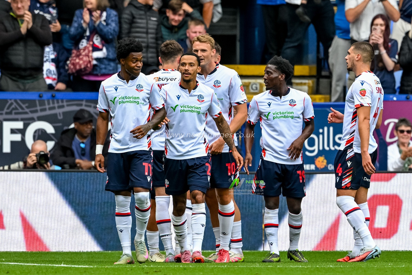 Joel Randall of Bolton Wanderers  and team mates celebrate their third goal during the Sky Bet League 1 match Bolton Wanderers vs AFC Wimbledon at Toughsheet Community Stadium, Bolton, United Kingdom, 6th September 2025

(Photo by Adam Gee/News Images)