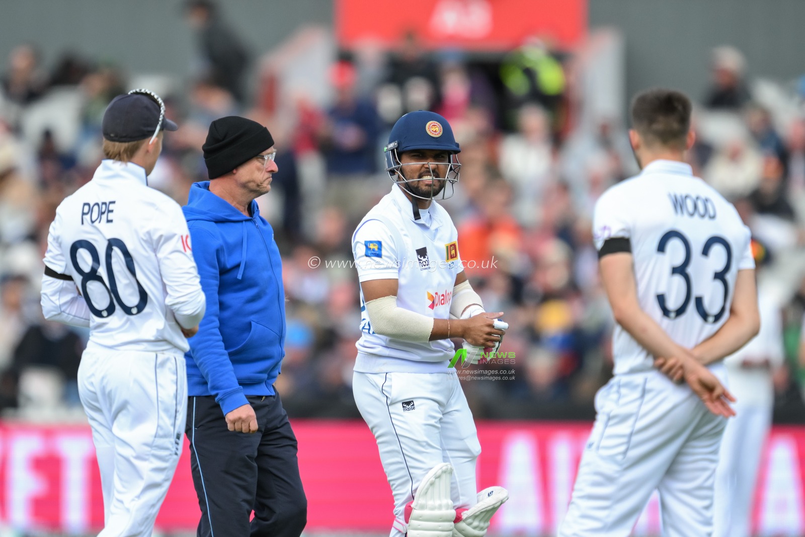 Dinesh Chandimal of Sri Lanka leaves the pitch with an injury from a bouncer ball from Mark Wood of England during the England Men v Sri Lanka 1st Rothesay Test Match Day 3 at Old Trafford, Manchester, United Kingdom, 23rd August 2024

(Photo by Craig Thomas/News Images)