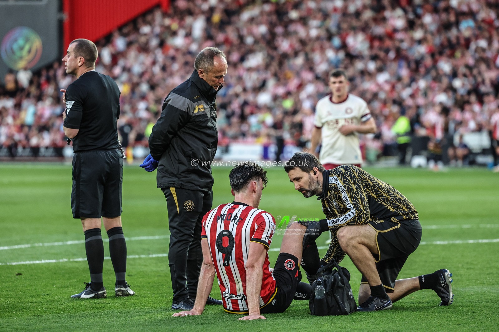 Kieffer Moore of Sheffield United receives treatment during the Sky Bet Championship Playoff Semi-final match Sheffield United vs Bristol City at Bramall Lane, Sheffield, United Kingdom, 12th May 2025

(Photo by Mark Cosgrove/News Images)