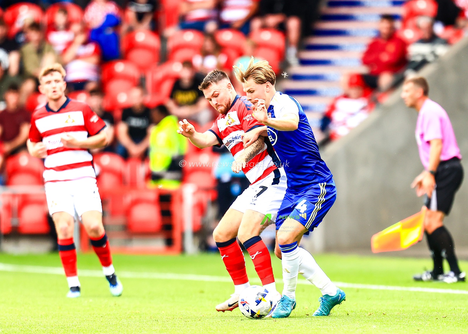 Glenn Middleton of Doncaster Rovers and Ed Turns of Exeter City battle for the ball during the Sky Bet League 1 match Doncaster Rovers vs Exeter City at Eco-Power Stadium, Doncaster, United Kingdom, 2nd August 2025

(Photo by Richard Bierton/News Images)