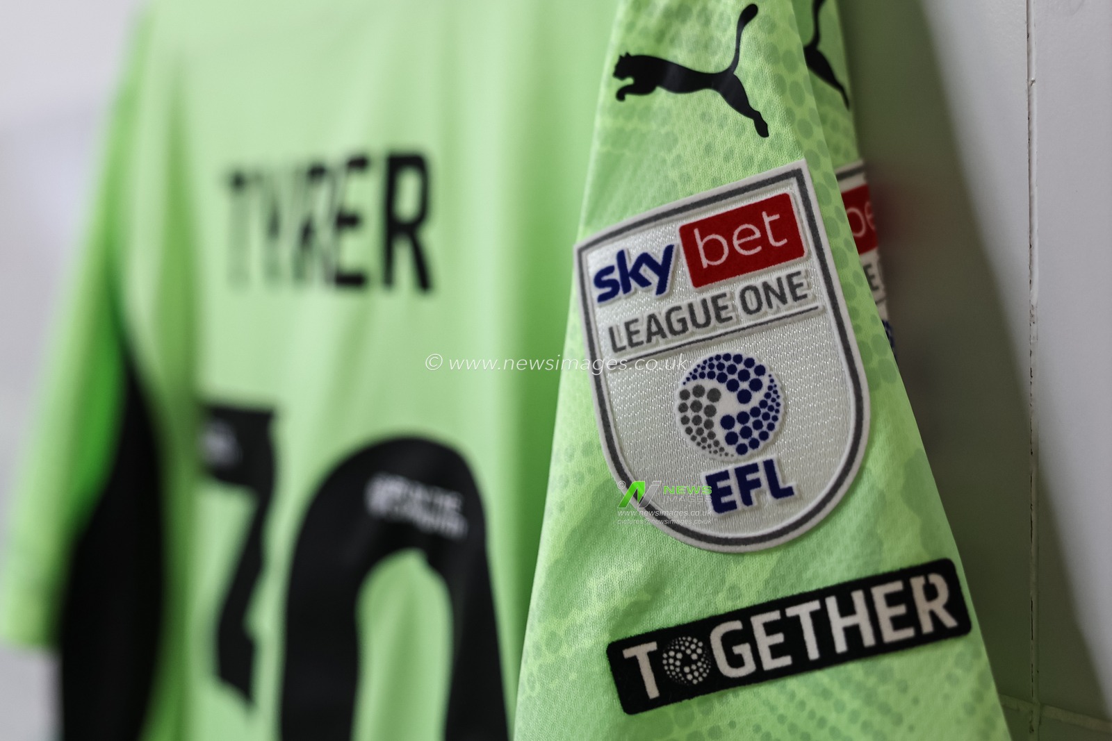 Together and Sky Bet League One badges during the Sky Bet League 1 match Wigan Athletic vs Blackpool at The Brick Community Stadium, Wigan, United Kingdom, 26th April 2025

(Photo by Mark Cosgrove/News Images)