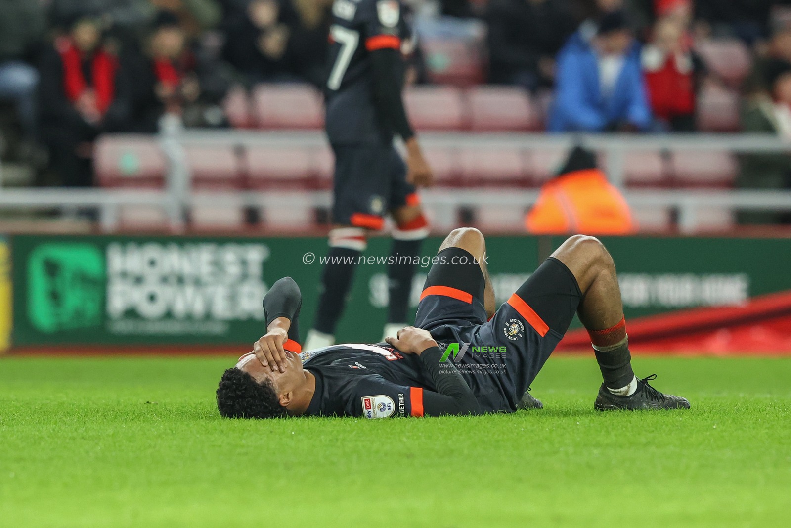 Reuell Walters of Luton Town lays on the floor after being hit by the ball from a free kick during the Sky Bet Championship match Sunderland vs Luton Town at Stadium Of Light, Sunderland, United Kingdom, 12th February 2025

(Photo by Alfie Cosgrove/News Images)