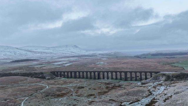 Snow falls on Pen-y-ghent and Ribblehead Viaduct area of the Yorkshire Dales
