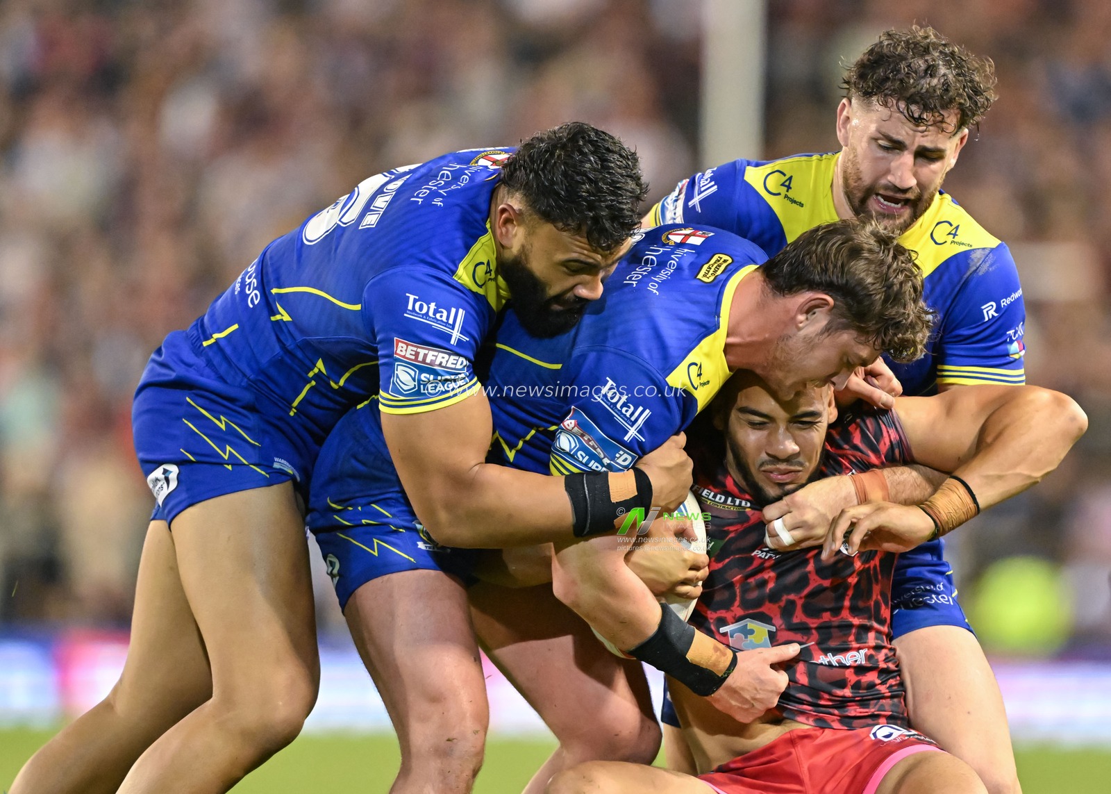 Darnell McIntosh of Leigh Leopards gets tackled during the Betfred Super League Round 24 match Leigh Leopards vs Warrington Wolves at Leigh Sports Village, Leigh, United Kingdom, 30th August 2024

(Photo by Cody Froggatt/News Images)