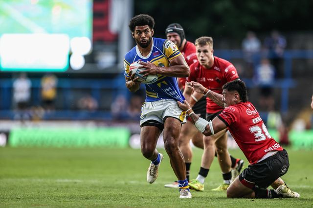 Kallum Watkins of Leeds Rhinos is tackled during the Betfred Super League round 19 match Leeds Rhinos vs Salford Red Devils at Headingley Stadium, Leeds, United Kingdom, 18th July 2025

(Photo by Alfie Cosgrove/News Images)