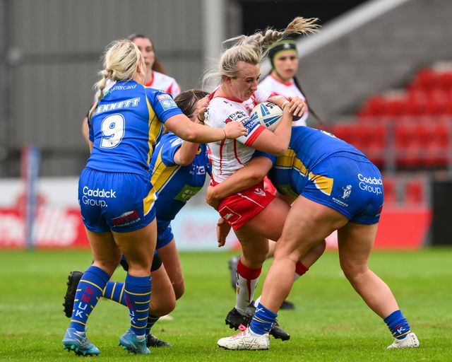 Jodie Cunningham of St Helens is tackled by Zoe Hornby of Leeds Rhinosduring the Betfred Women's Super League match St Helens vs Leeds Rhinos at Totally Wicked Stadium, St Helens, United Kingdom, 24th May 2024

(Photo by Craig Thomas/News Images)
